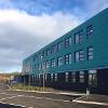 QMA side view of building with green cladding