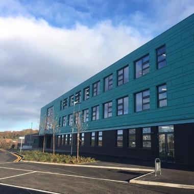 QMA side view of building with green cladding